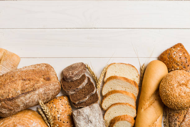 istock Homemade natural breads. Different kinds of fresh bread as background, top view with copy space 2155980642