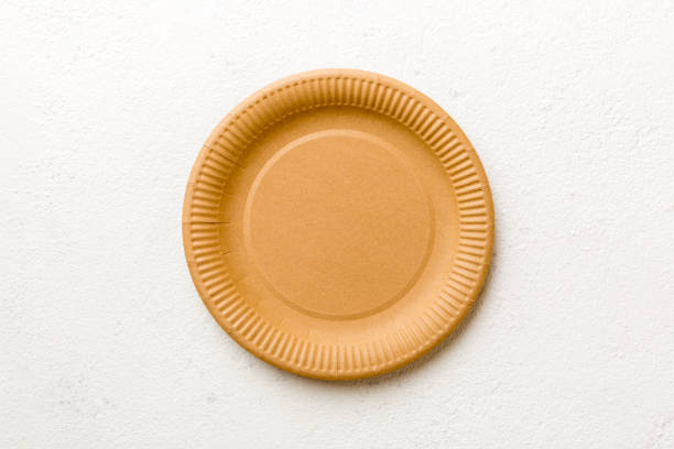 istock Top view of eco paper plate on cement background. Empty space for your design 2155980661