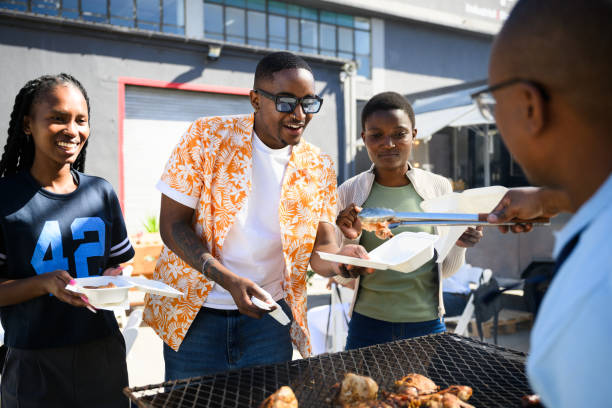 Students purchasing barbecued meat froma street vendor