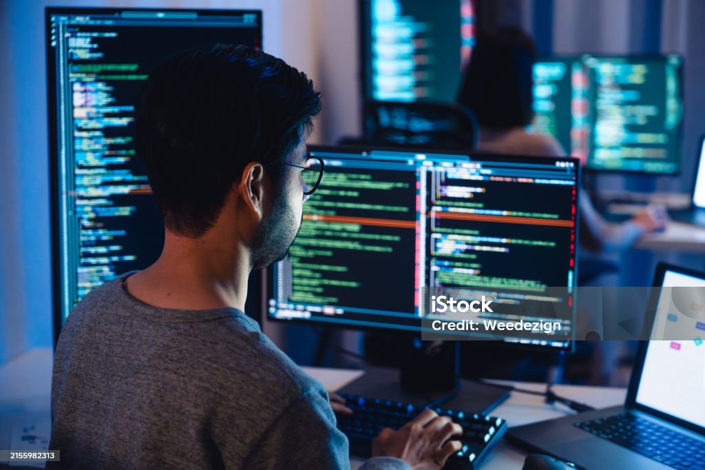 Asian Developer Asian Software Developers Working On Multiple Screens Displaying Code ...