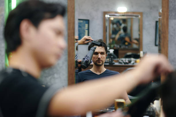 istock Man Attending Hairdresser 2155983078