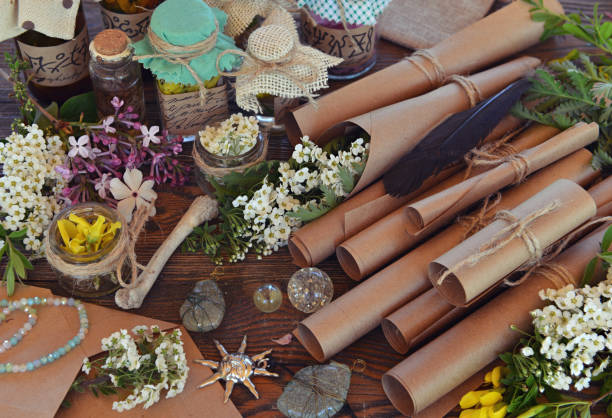 istock Mystic still life with ancient paper scrolls, healing herbs and witchy ritual objects on old table. Occult, esoteric, wicca and divination concept. No foreign language, all symbols are fictional 2155983191