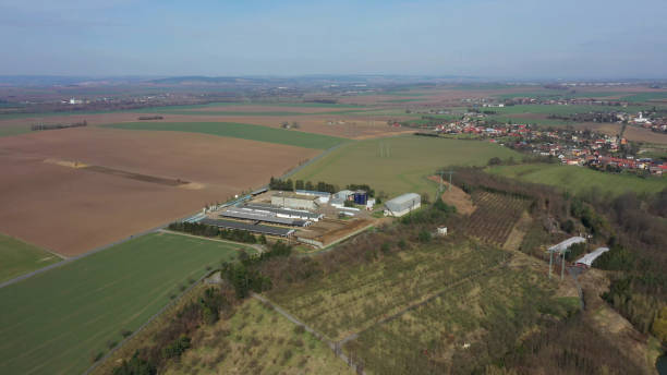istock Fields cowshed farm field intensive dairy cows feeding barn drone aerial video shot, large agricultural activity agriculture farming Holstein Friesian cattle breed milk, cowshed not bricked, Holsteins 2155986447