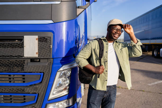 istock Happy truck driver on parking lot ready to work. 2155987494