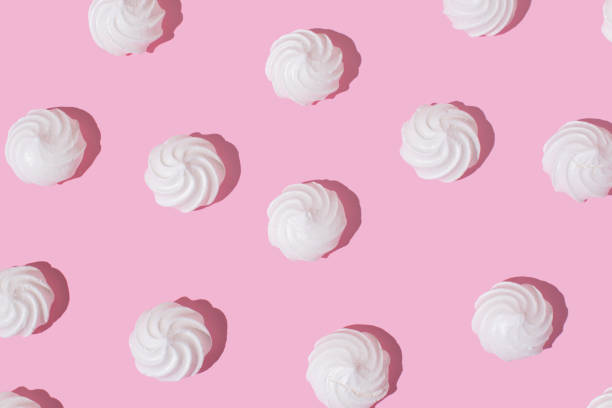 istock White meringue cookies on bright pink background 2155988209