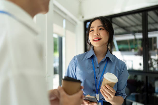 istock Two business colleagues talking work in Office. Concept of Networking and Professional Interaction 2155989269