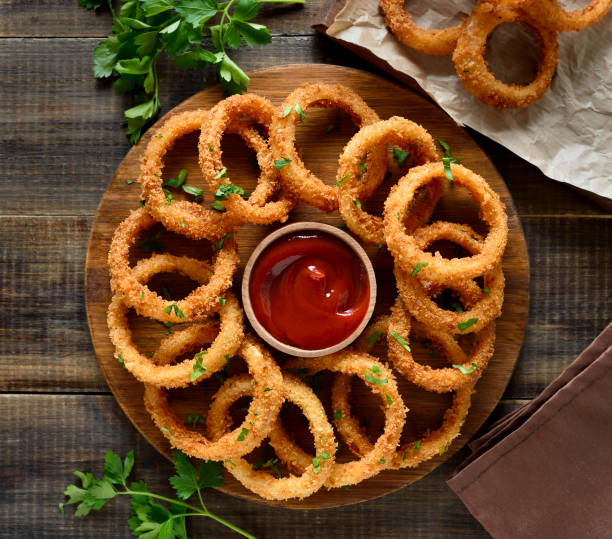 istock Onion rings with tomato sauce 2155989328