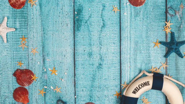 istock Beach accessories on blue board - summer holiday banner. Flat lay. Top view. Copy space 2155989428