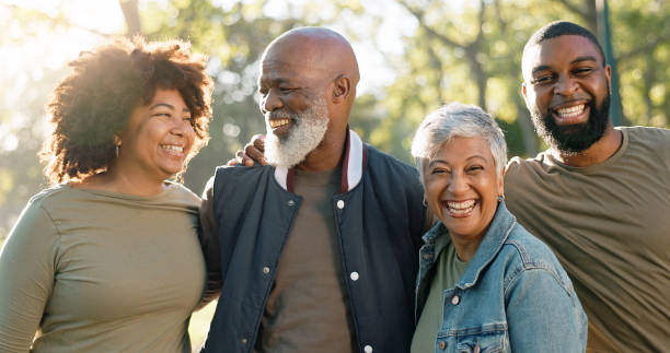 istock Hug, volunteer or group in park, portrait or teamwork with collaboration, environment or support. Charity, people or friends with nature, cooperation or embrace for motivation, eco friendly or laugh 2155990954