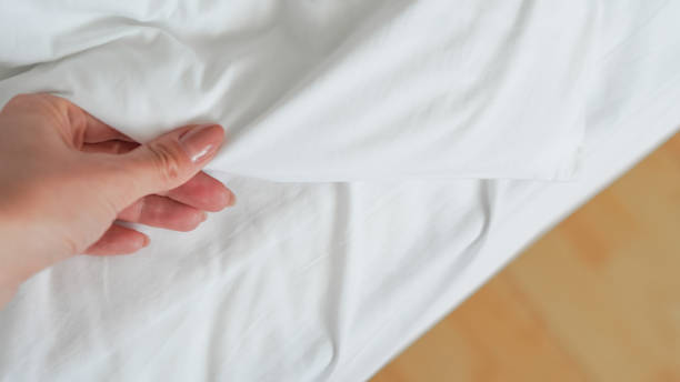istock close up of  white bedsheet background ,good hotel service 2155991050
