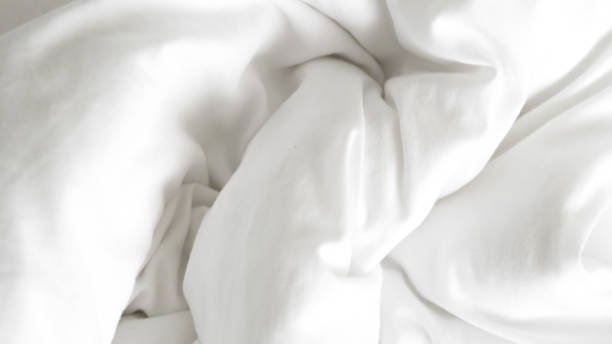 istock close up of  white bedsheet background ,good hotel service 2155991054