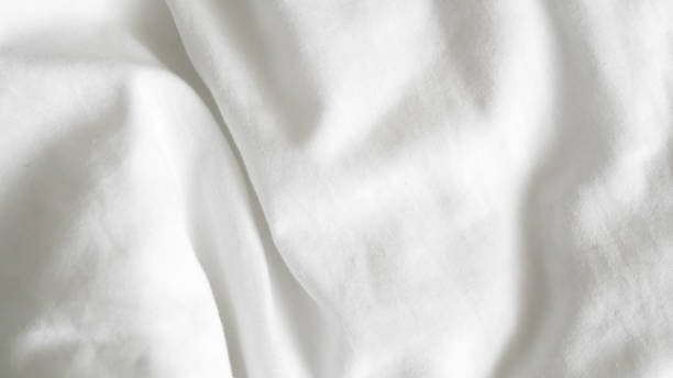 istock close up of  white bedsheet background ,good hotel service 2155991062
