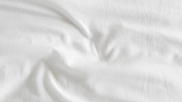 istock close up of  white bedsheet background ,good hotel service 2155991069