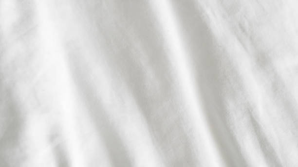 istock close up of  white bedsheet background ,good hotel service 2155991072