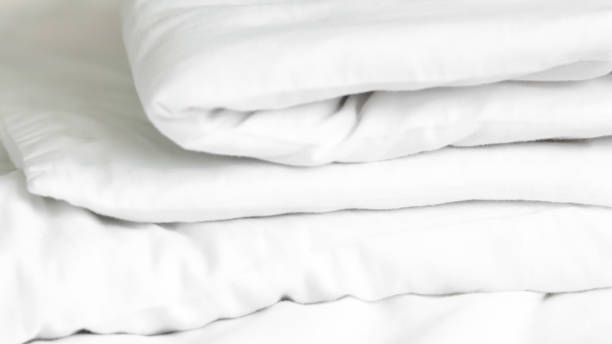 istock close up of  white bedsheet background ,good hotel service 2155991125