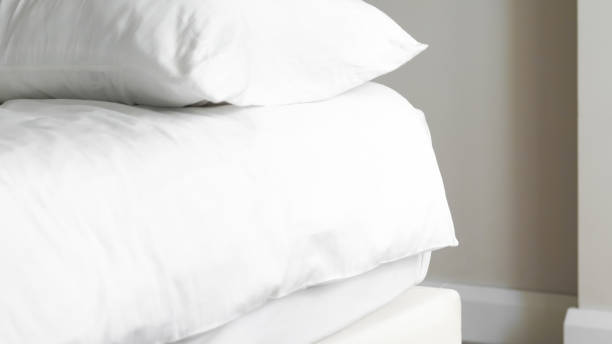 istock close up of  white bedsheet background ,good hotel service 2155991259