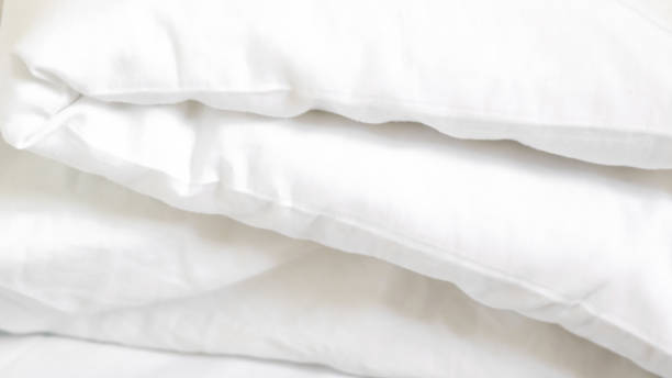 istock close up of  white bedsheet background ,good hotel service 2155991322