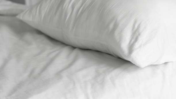 istock close up of  white bedsheet background ,good hotel service 2155991327