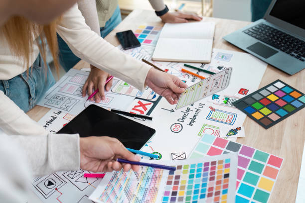 istock UI designer and UX developer brainstorm idea to design the application appearance in the early stage. Creative digital development agency. UX UI concept 2155991513