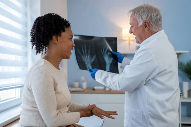 istock A friendly and informative conversation about an x-ray, between a doctor and a patient 2155992564