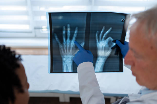 istock Explaining the hand injury to the patient 2155992576