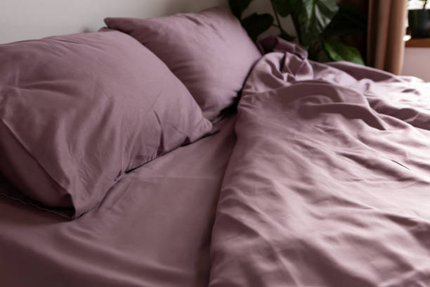 istock cotton bed linen color dusty rose messy indoor 2155993635