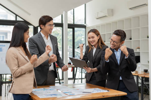 istock Group of Asian businessmen are presenting graphs on a whiteboard. 2155994081