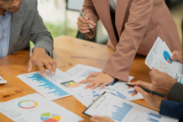 istock Asian business group discussing graph work at the office 2155994211
