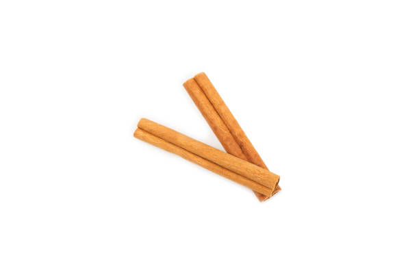 istock Cinnamon sticks on a textured wooden background. Cinnamon roll. Spicy spice for baking, desserts and drinks. Fragrant ground cinnamon. cinnamon powder Close-up. Place for text. copy space 2155994956
