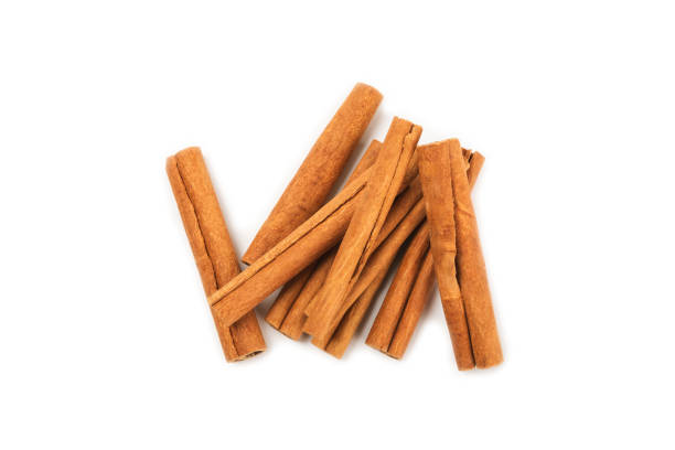 istock Cinnamon sticks on a textured wooden background. Cinnamon roll. Spicy spice for baking, desserts and drinks. Fragrant ground cinnamon. cinnamon powder Close-up. Place for text. copy space 2155996096