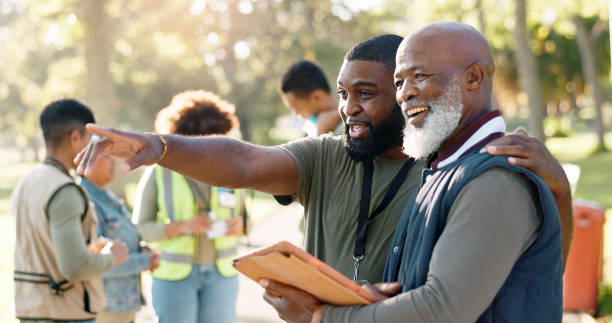 istock Park, people and volunteers planning with tablet for support, community project or nature sustainability. Humanitarian, recycling or senior leader in charity service or NGO for pollution cleanup 2155997102