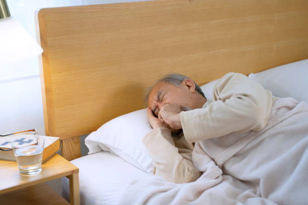 istock Senior man is sick and sleeping in bedroom. 2156000851