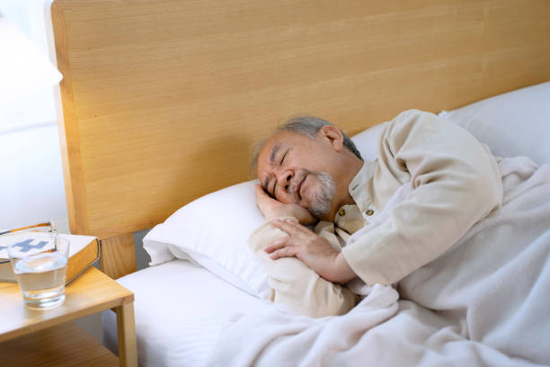 istock Senior man is sick and sleeping in bedroom. 2156000853