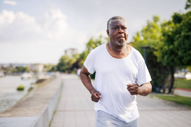 istock a senior black african man training outside 2156000860