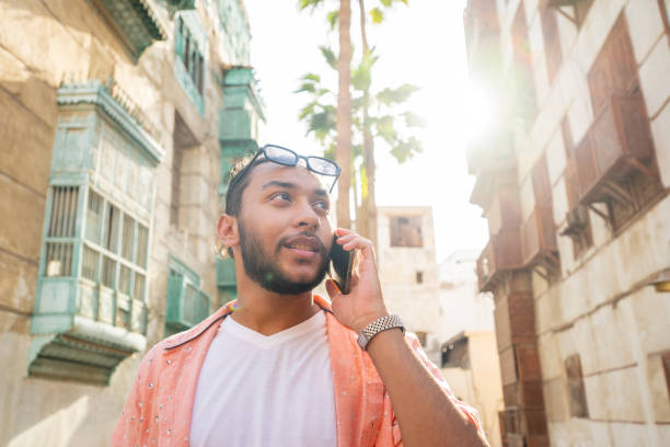 istock Saudi Arabian man using phone in Jeddah 2156001675