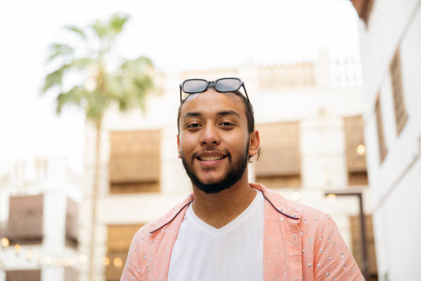 istock Smiling young Arab man in city 2156001702