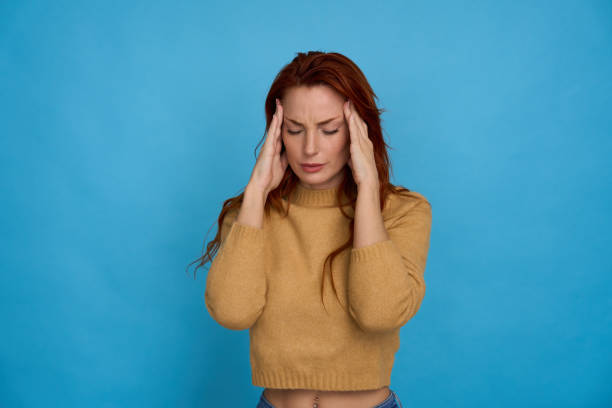 istock Young woman suffering from a headache 2156001854