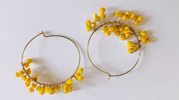 istock yellow hoop earrings on a white background 2156004963