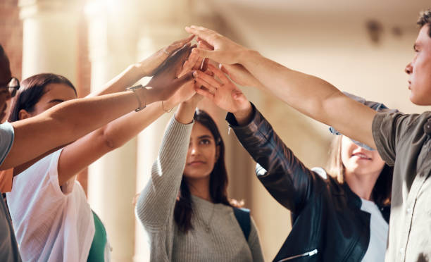 istock Support, team building and hands of students at college with collaboration, motivation and education success. Teamwork, happy and friends at university with solidarity, goals and mission on campus 2156006451