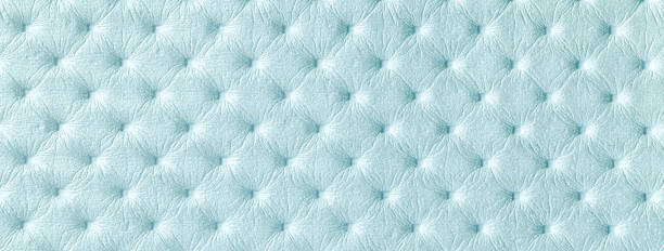 istock Texture of light blue leather background with capitone pattern, macro. Sky pastel textile of retro Chesterfield style. 2156008243
