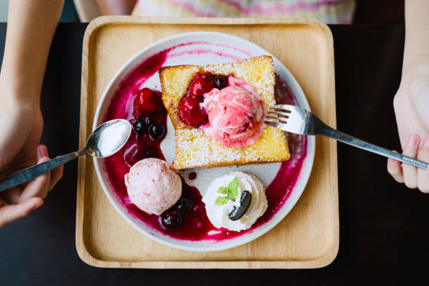 Strawberry ice cream shot on rustic wooden table