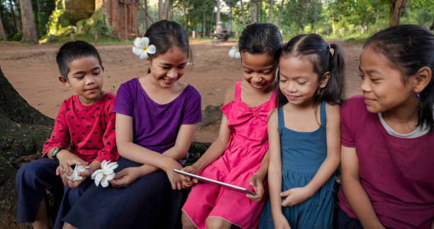 istock Cambodian children using digital tablet in village, Cambodia 2156008809