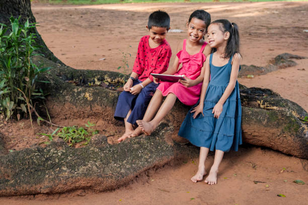 istock Cambodian children using digital tablet in village, Cambodia 2156008968