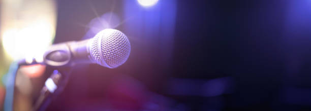 istock Microphone on the stage at the concert in the evening 2156009823