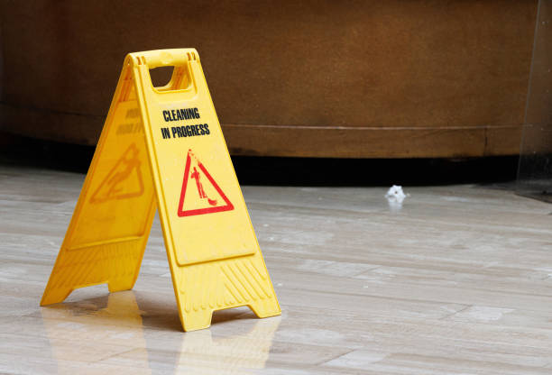istock A yellow sign with a red triangle on it that says 