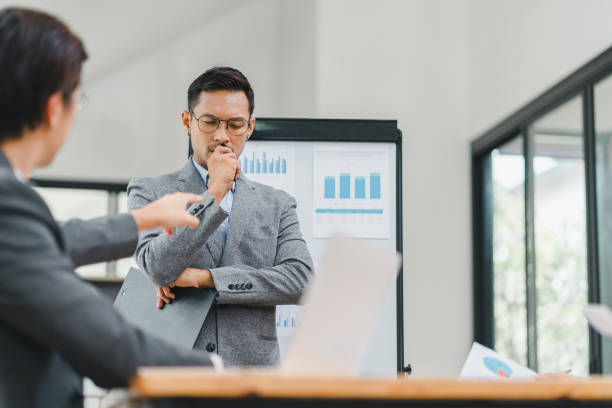 istock Businessman feeling stressed during a presentation in an office. 2156013367