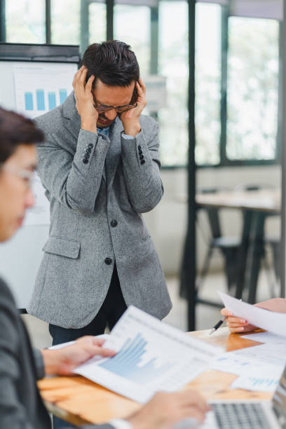 istock Businessman feeling stressed during a presentation in an office. 2156013391