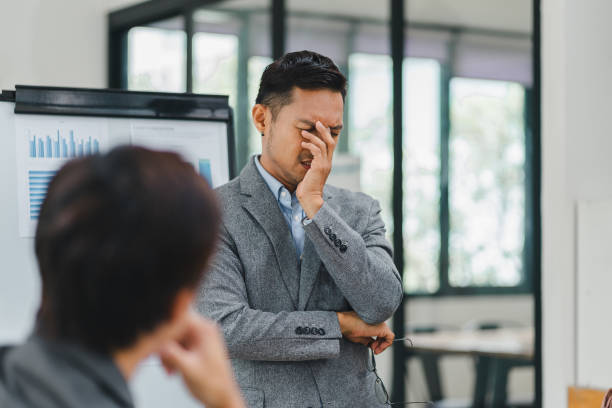 istock Businessman feeling stressed during a presentation in an office. 2156013395