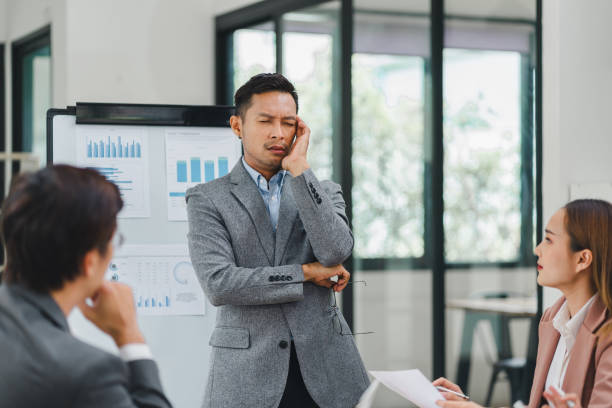 istock Businessman feeling stressed during a presentation in an office. 2156013405
