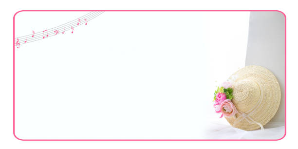 straw hat with pink flower and four Leaf Clover corsage / white background.
